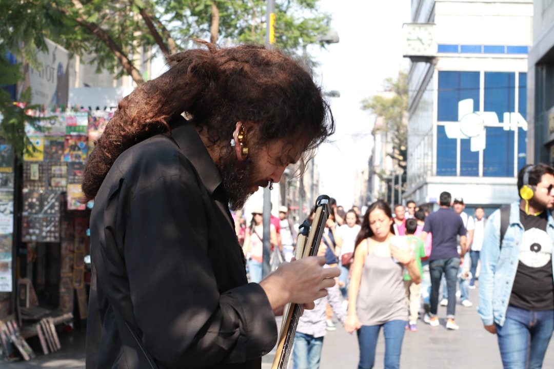 📝 Conclusion: Wrapping Up Your Quest for the Ultimate Checklist App by Daily Checklist man in black suit playing guitar