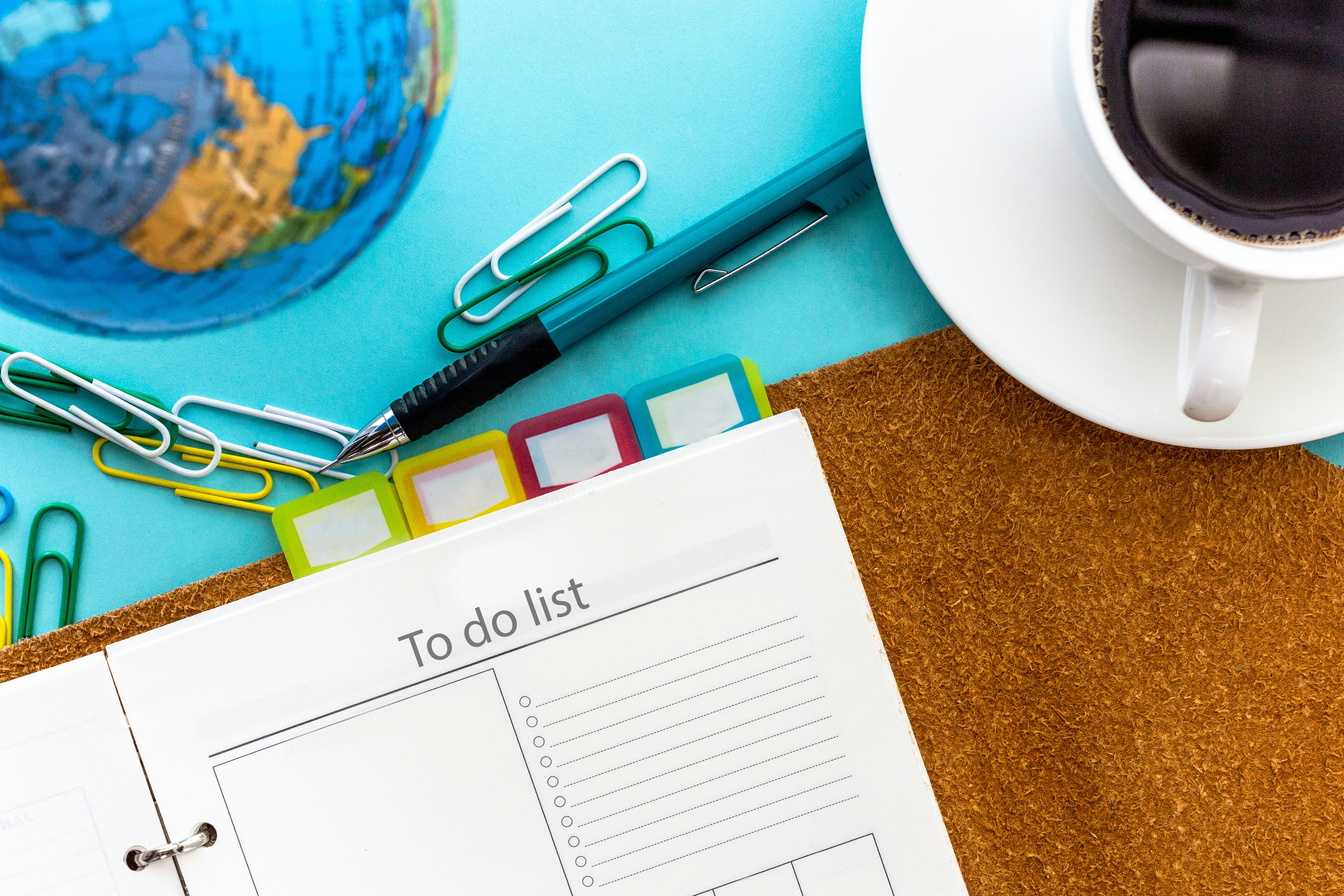 Todo list planner, organizer, business background workspace. by Daily Checklist a calendar and scissors on a table